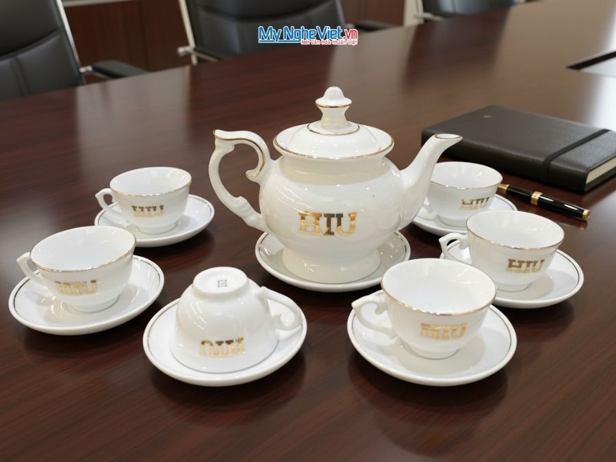 Bộ ấm chén - bình trà men trắng in logo HIU
